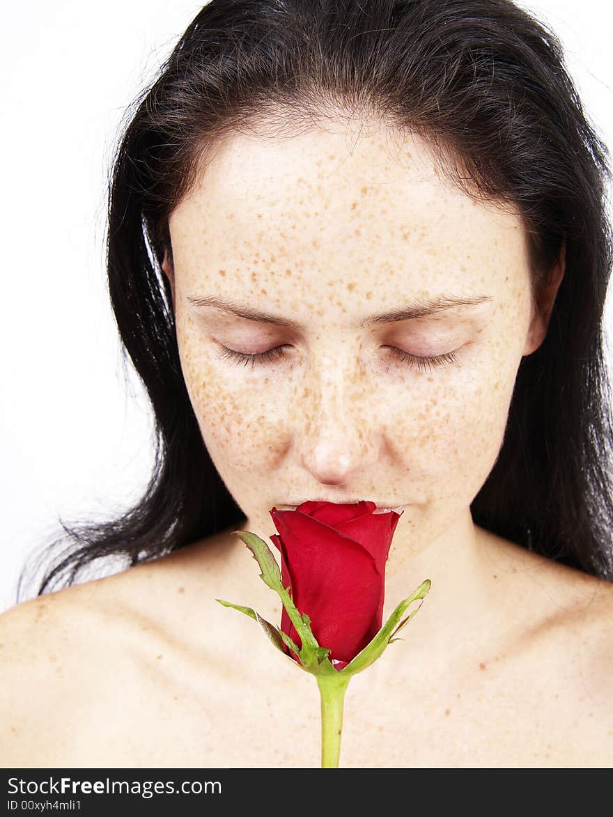 Beautiful brunette woman holding a single red rose. Beautiful brunette woman holding a single red rose