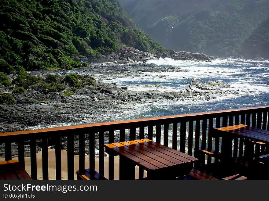 Outdoor cafe near stormy ocean beach