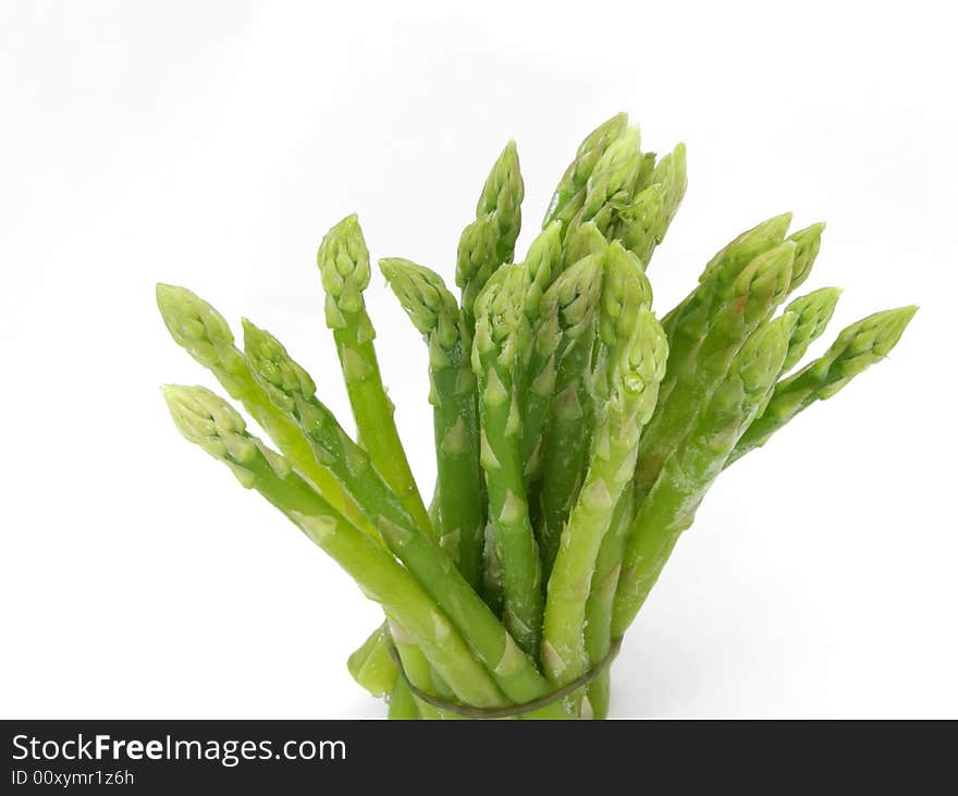 close up of frozen asparagus on white. close up of frozen asparagus on white