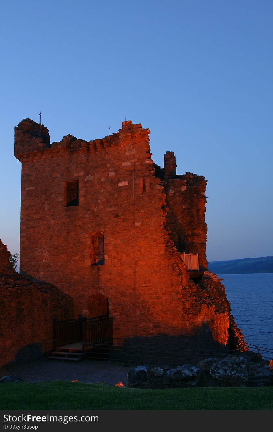 The ruins of the castle at Urquhart at night near Inverness on the banks of Loch Ness in Scotland. The ruins of the castle at Urquhart at night near Inverness on the banks of Loch Ness in Scotland