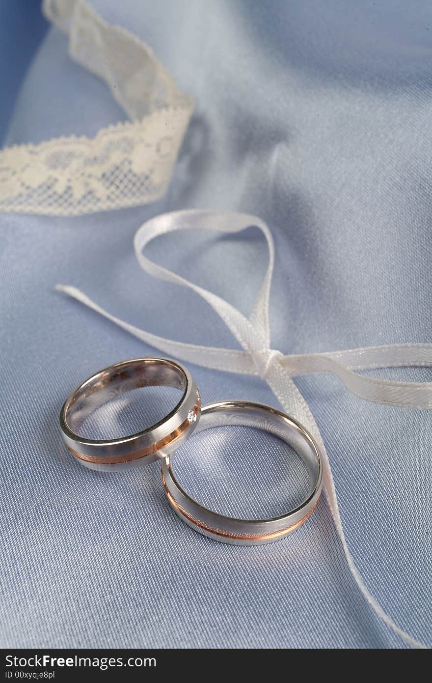 Wedding rings on a blue background