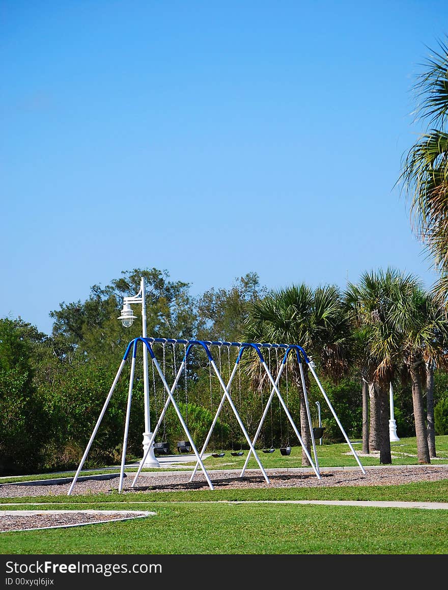 Photo of a swings out on a playground in Florida.