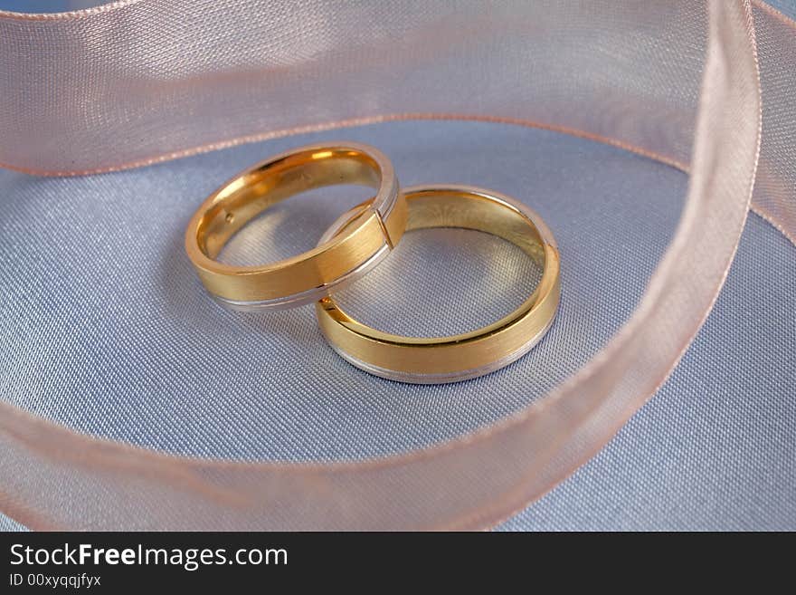 Wedding rings on a blue background