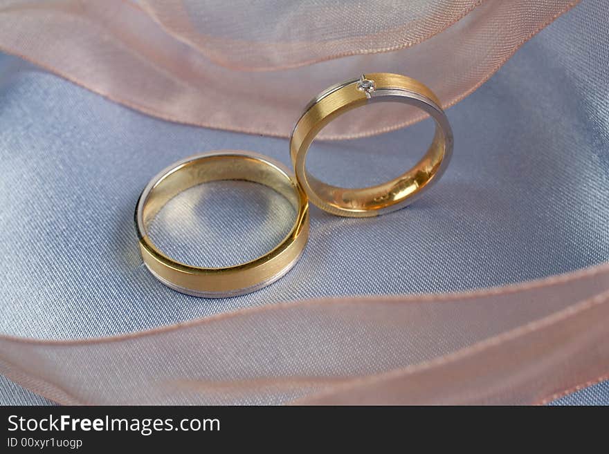 Wedding rings on a blue background