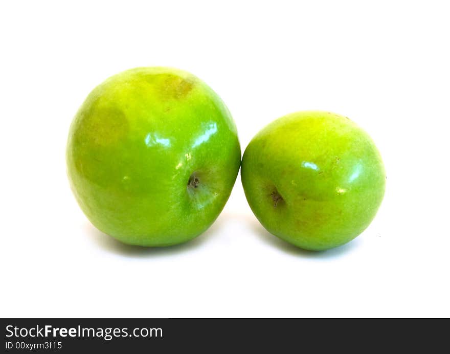 Two green apples on white background.