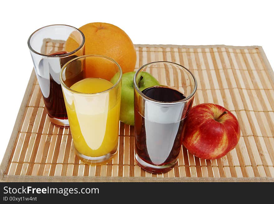 Three glass of juice and green, red apple, grapefruit. Three glass of juice and green, red apple, grapefruit