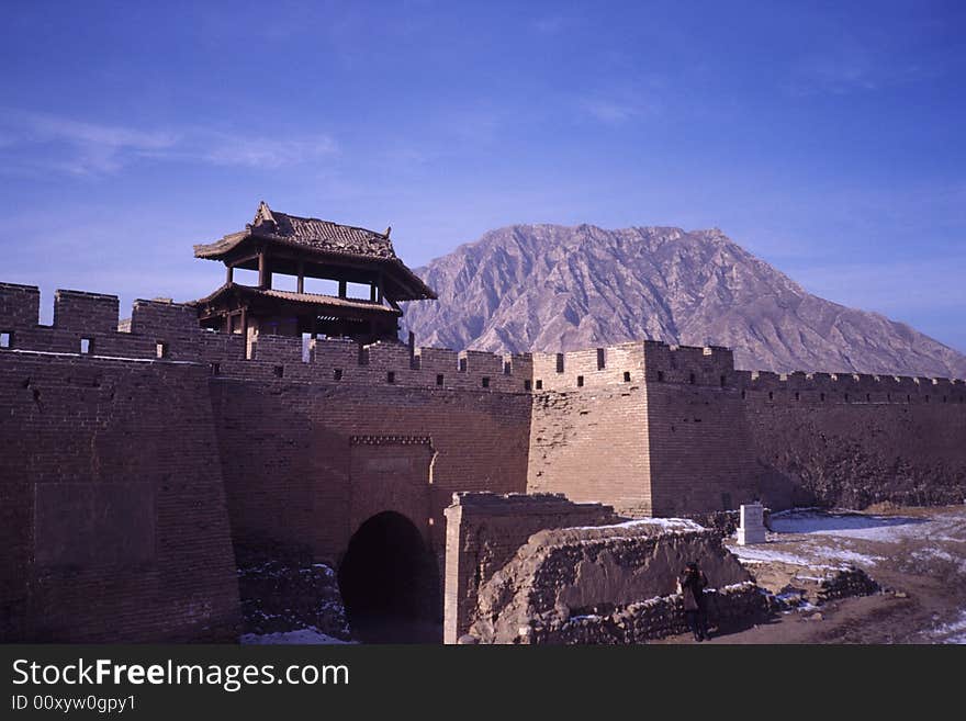 Chinese ancient dak castle with high walls and tower