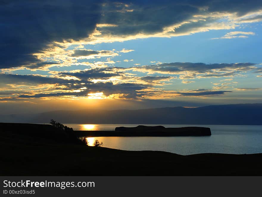 Beautiful sunset. Baikal lake. Blue mountains. Beautiful sunset. Baikal lake. Blue mountains