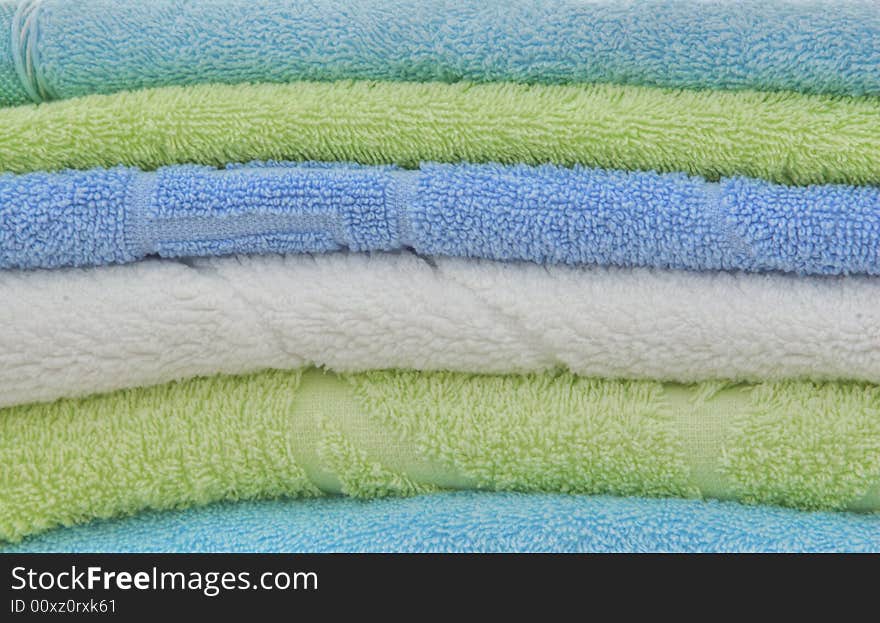 The combined multi-colored double towels as a background. The combined multi-colored double towels as a background