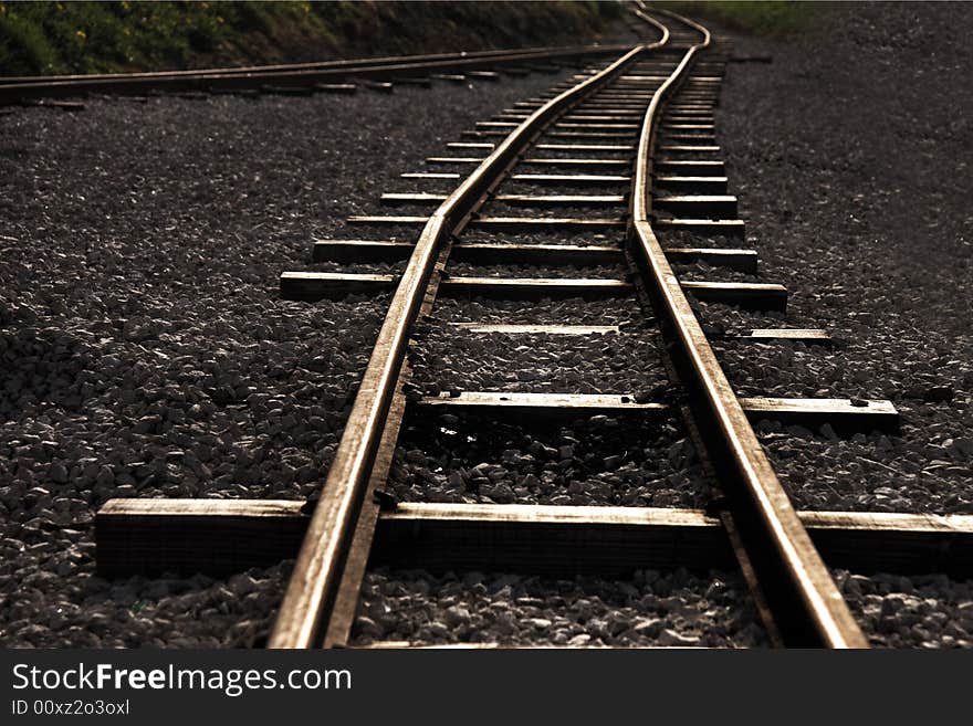 Photo of rails leaving in a distance