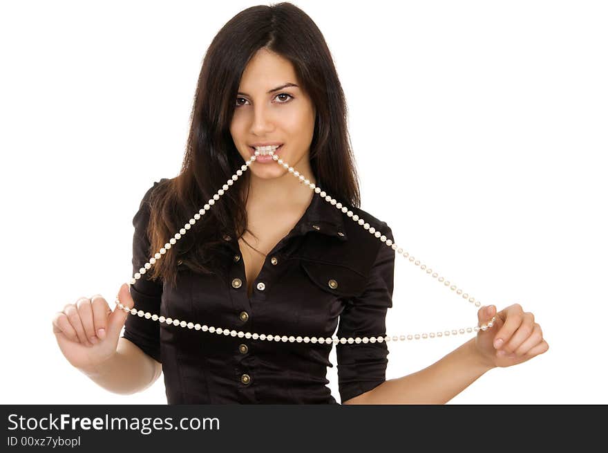 The girl holds a beads from pearls