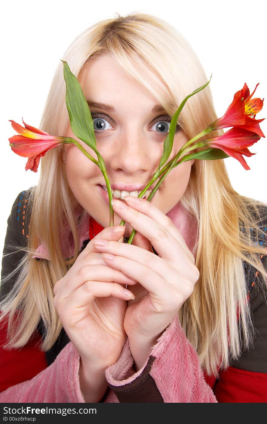 The blonde holds red flowers