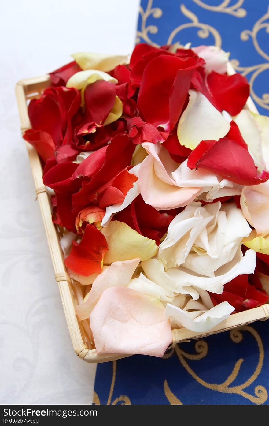 Wedding basket. Petals roses in basket cloth