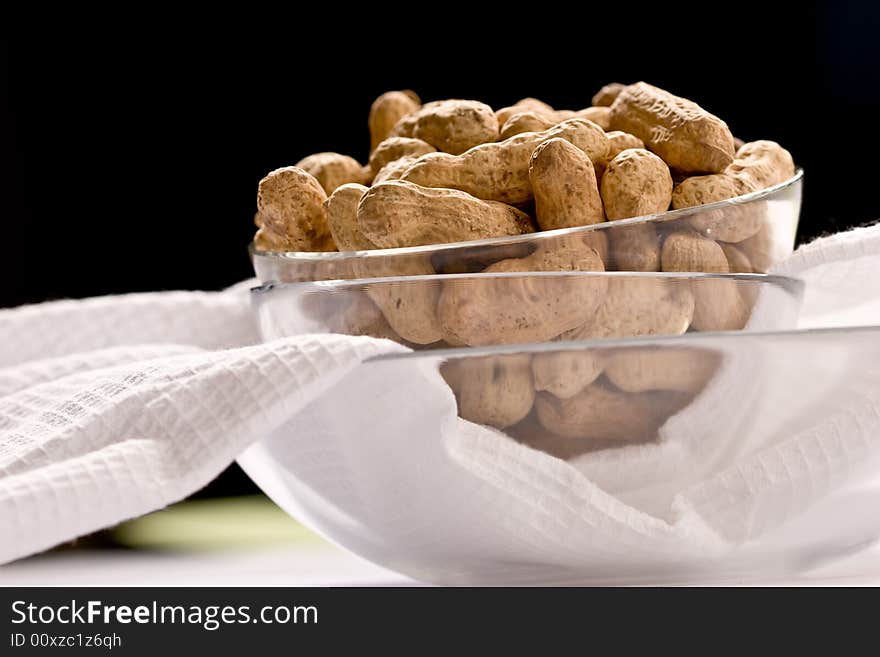 Foodstuff theme: peanut on the glassy bowl