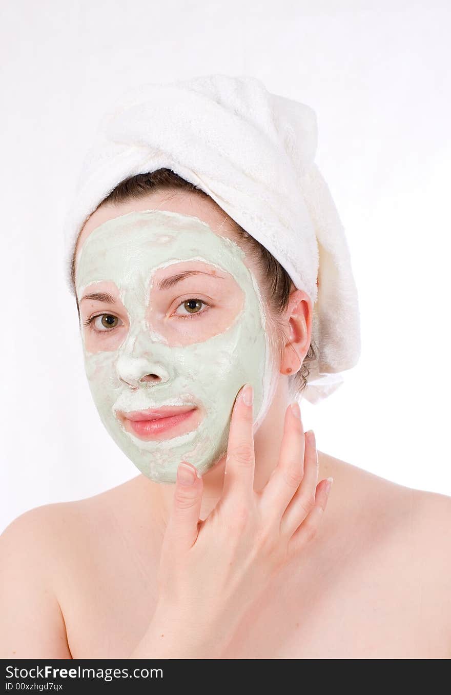 Woman with green mask on her face healthy treatment. Woman with green mask on her face healthy treatment