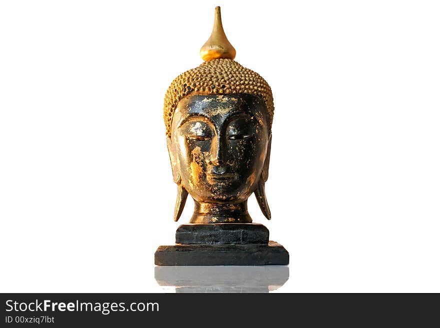 A sculpture of the head of Buddha made in wood. Isolated on a white background. A sculpture of the head of Buddha made in wood. Isolated on a white background