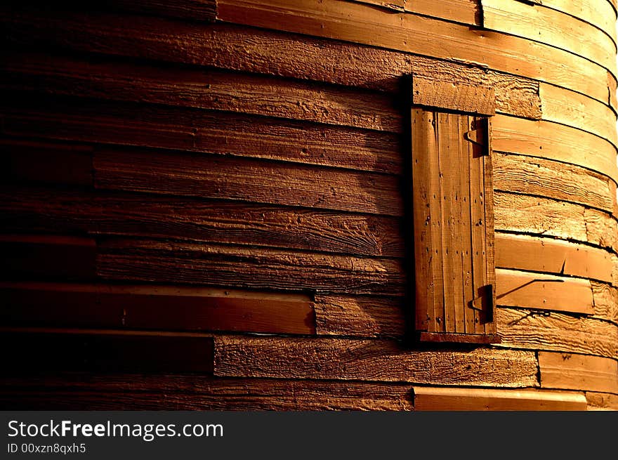 Window in a Historic Round Barn at Sunrise Showing Various Shades of Light and Shadow. Window in a Historic Round Barn at Sunrise Showing Various Shades of Light and Shadow