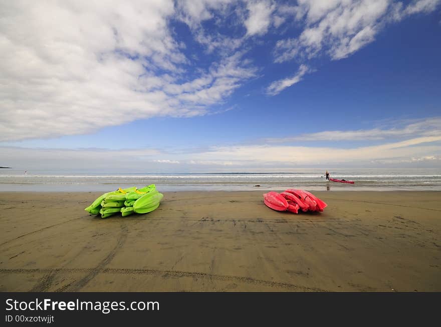 Colorful kayaks lay on the beach. Colorful kayaks lay on the beach