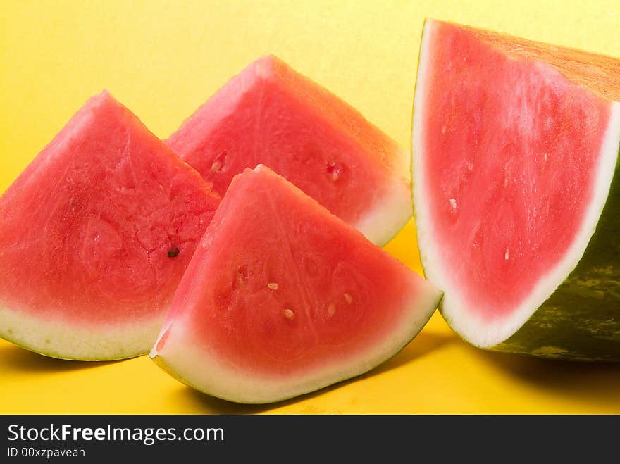 Juicy watermelon in yellow background. Juicy watermelon in yellow background