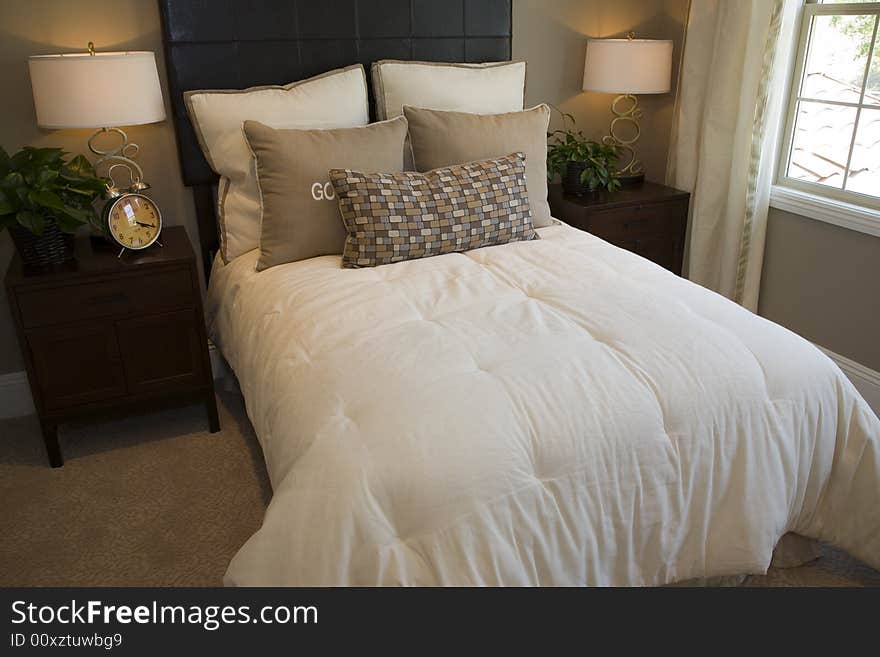 Designer bedroom with contemporary furniture and decor. Designer bedroom with contemporary furniture and decor.