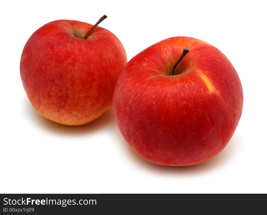 Two red bright apples isolated on white