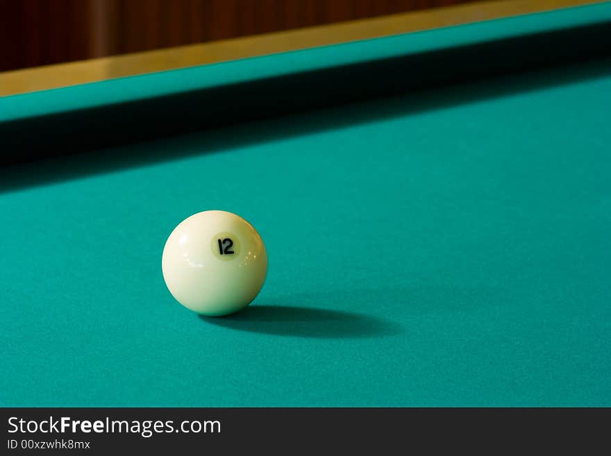 Billiard-ball number twelve on a green table