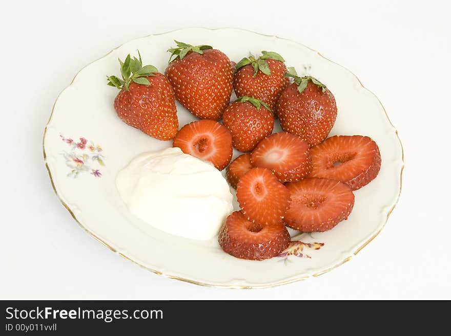 Strawberry with sour cream on a dish