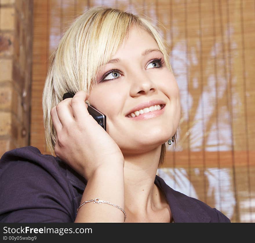 Young gril holding mobile phone, listern to conversation. Young gril holding mobile phone, listern to conversation