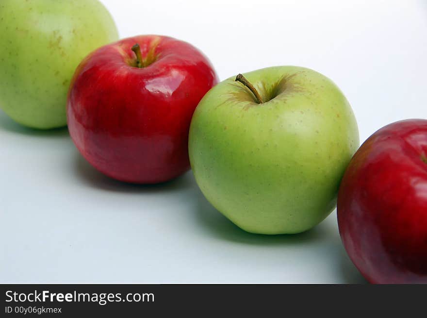 Green apple red apple with white background,close up shot