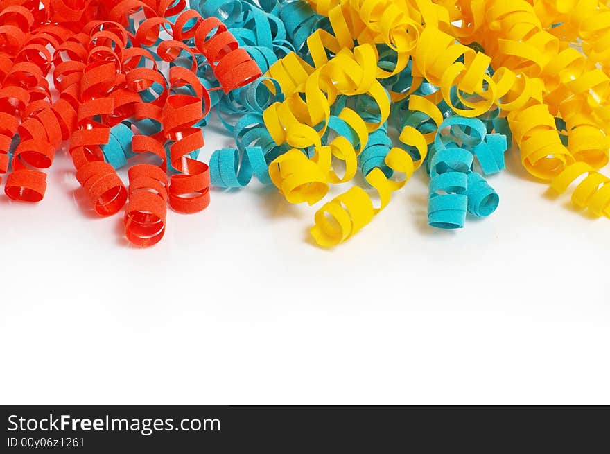 Color tinsel on a white background, across