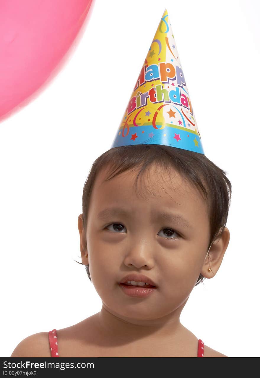 Little girl looking up with the balloon