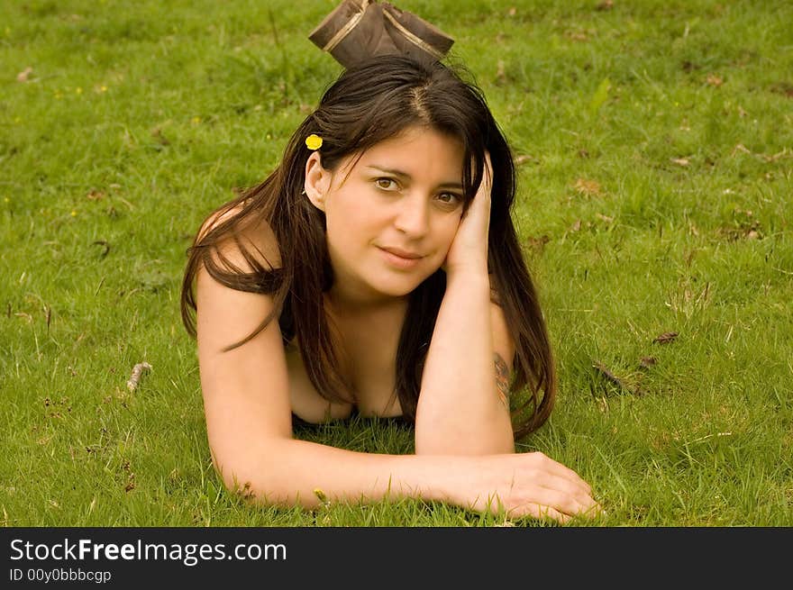 Attractive woman lying in a meadow