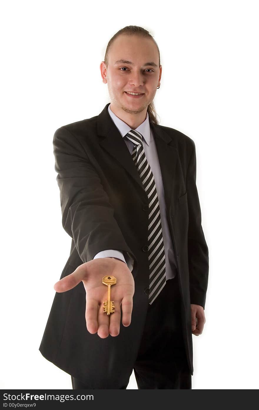 Businessman holding key isolated on white background