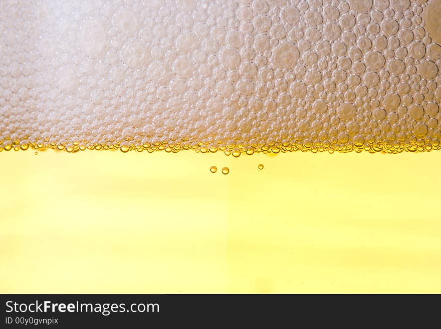 Background from fresh foamy beer.