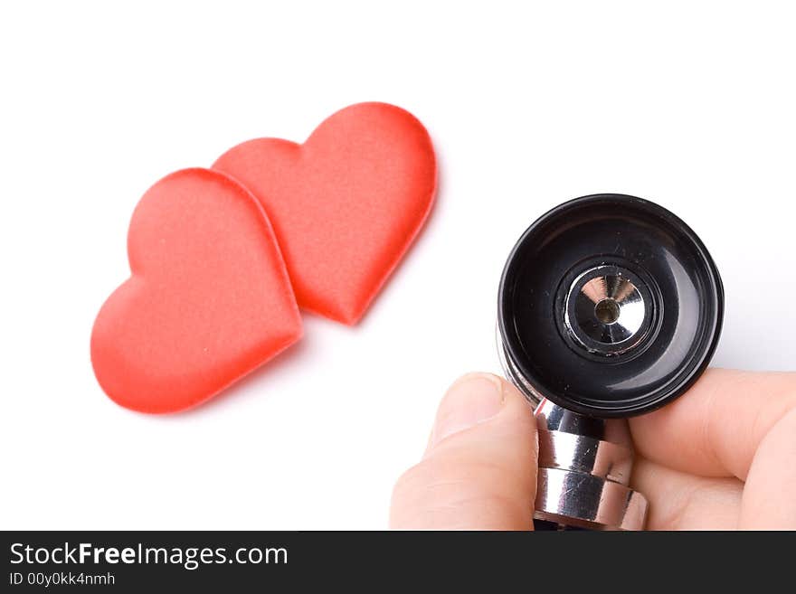 Heart and a stethoscope on a white background. Concept for cardiology.