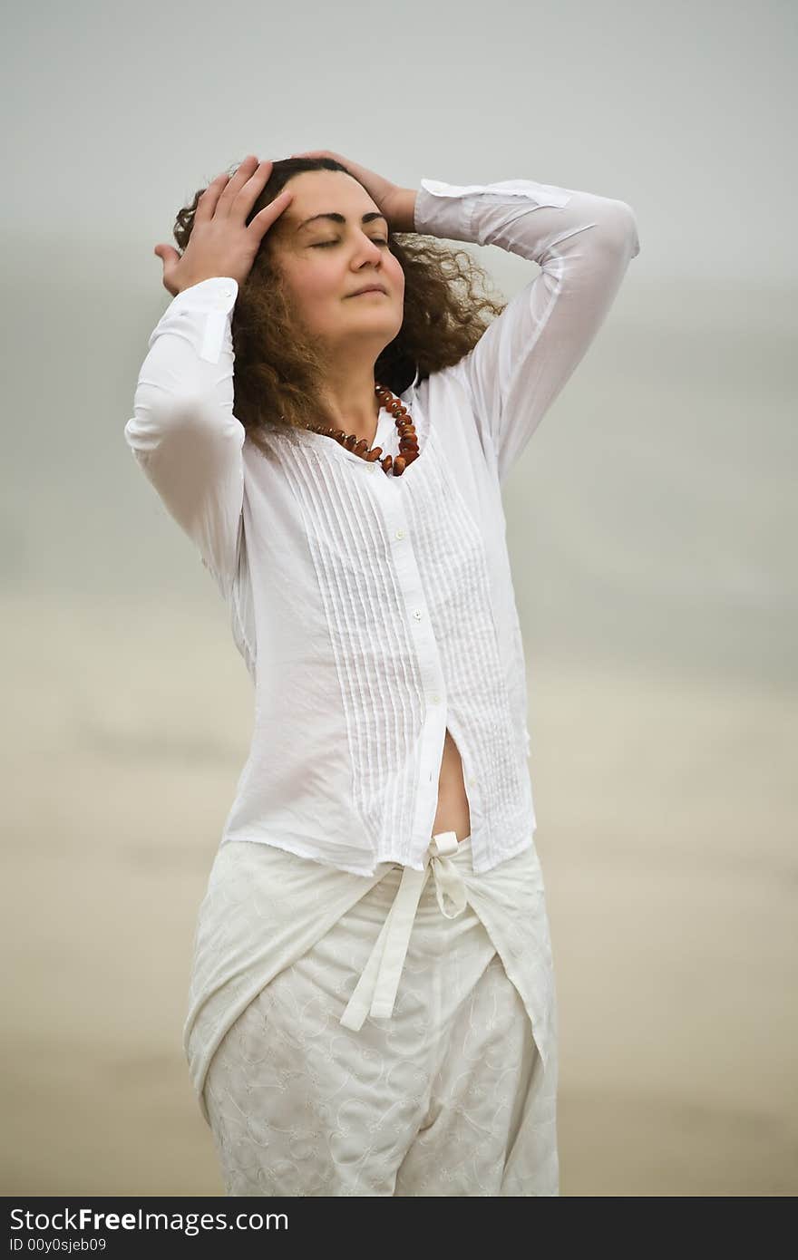 Portrait of attractive young woman on the beach