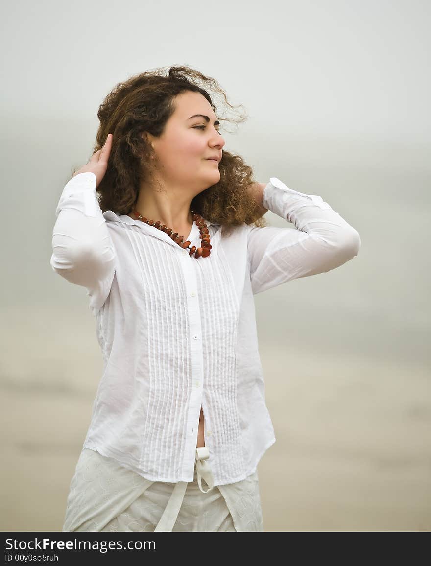 Portrait of attractive young woman on the beach