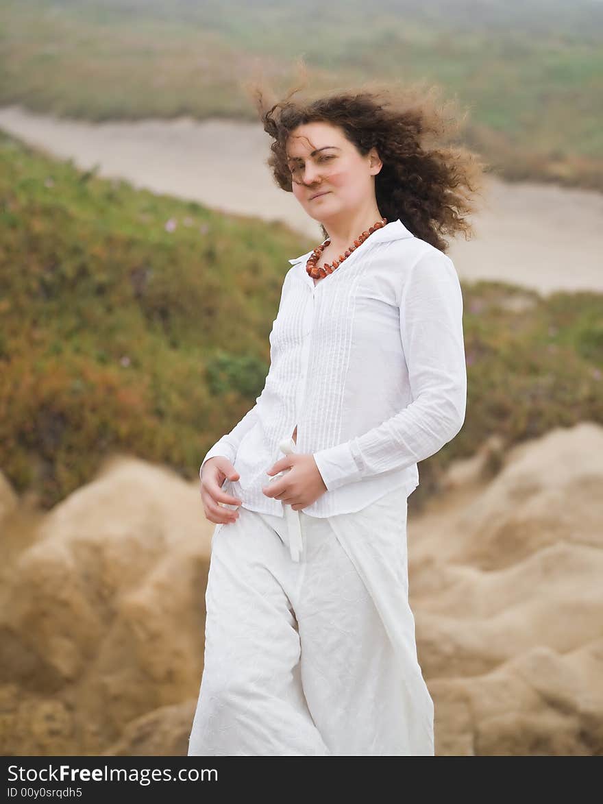 Portrait of attractive young woman on the beach