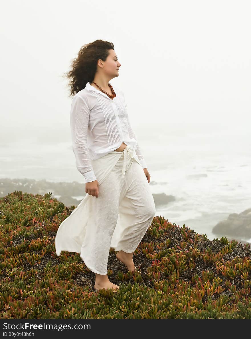 Portrait of attractive young woman on the beach