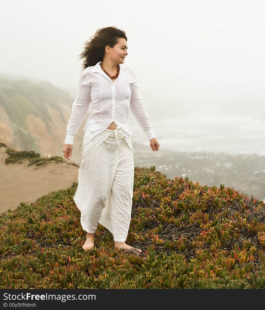 Portrait of attractive young woman on the beach