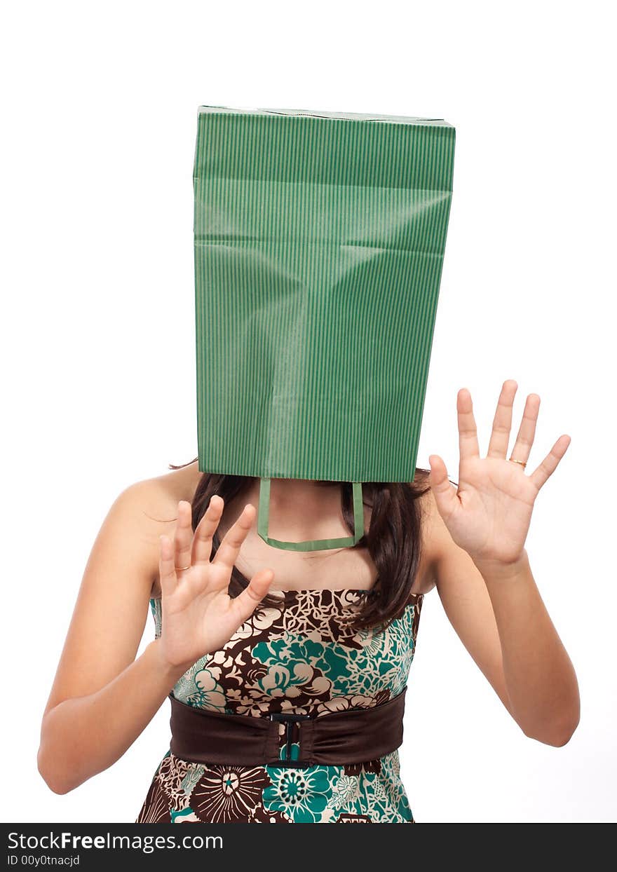 Shopping girl cover her head with green bag