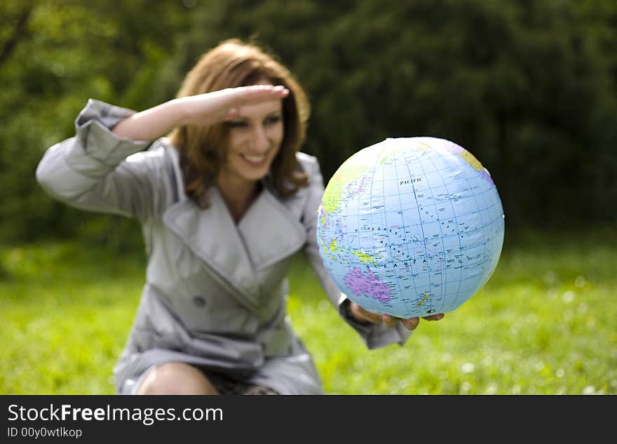 Young Woman Looking On Globe. Travel Concept. Young Woman Looking On Globe. Travel Concept.
