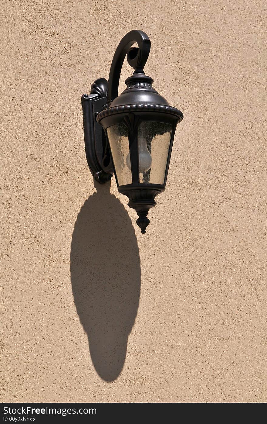 Lantern with shadow with stucco wall. Lantern with shadow with stucco wall