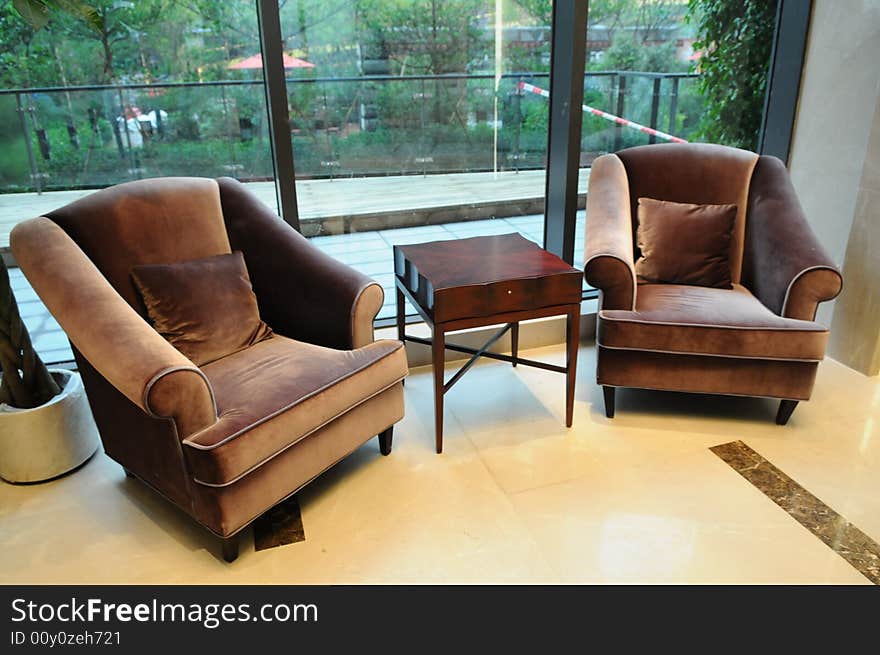 The flannelette sofas in the parlor with glass wall.