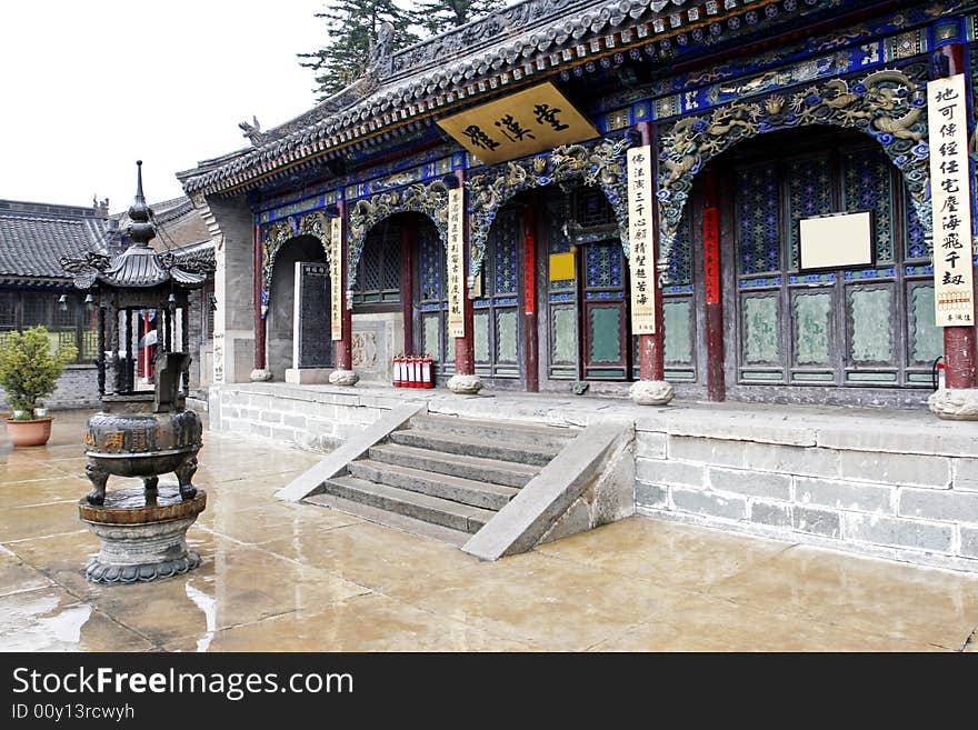 Scenery in the courtyard of the temple. Chinese characters on the horizontal inscribed board are arhat's hall. Chinese characters on both sides of the door and four posts are the ancient Chinese Buddhism text. Chinese characters on the incence burner are the south mountain temple, build it in A.D. 1,000. Chinese characters on the stone tablet is merit tablet on the left of the temple.The main idea of Chinese characters is that an offspring remember you forever. Scenery in the courtyard of the temple. Chinese characters on the horizontal inscribed board are arhat's hall. Chinese characters on both sides of the door and four posts are the ancient Chinese Buddhism text. Chinese characters on the incence burner are the south mountain temple, build it in A.D. 1,000. Chinese characters on the stone tablet is merit tablet on the left of the temple.The main idea of Chinese characters is that an offspring remember you forever.............