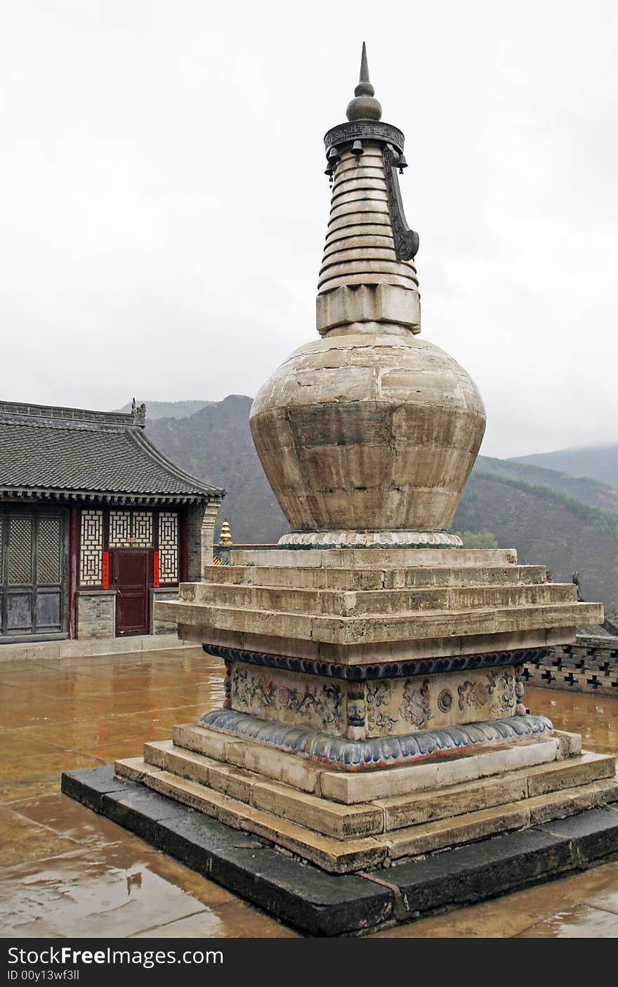 Tower in the ancient temple. 
This tower has already had a history of a thousand years.

Chinese characters on the door of background and both sides are a text of Buddhism.