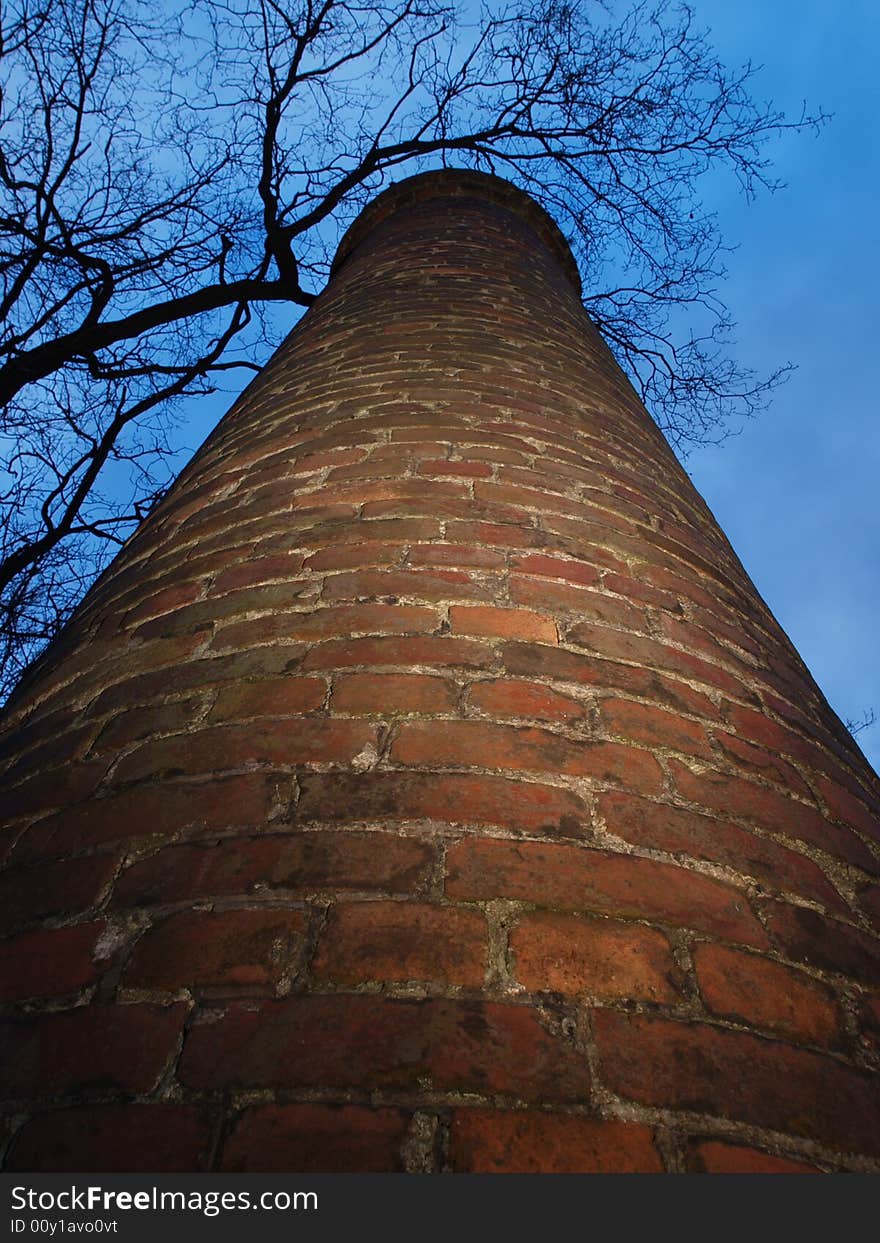 Old factory chimney reaching for the sky