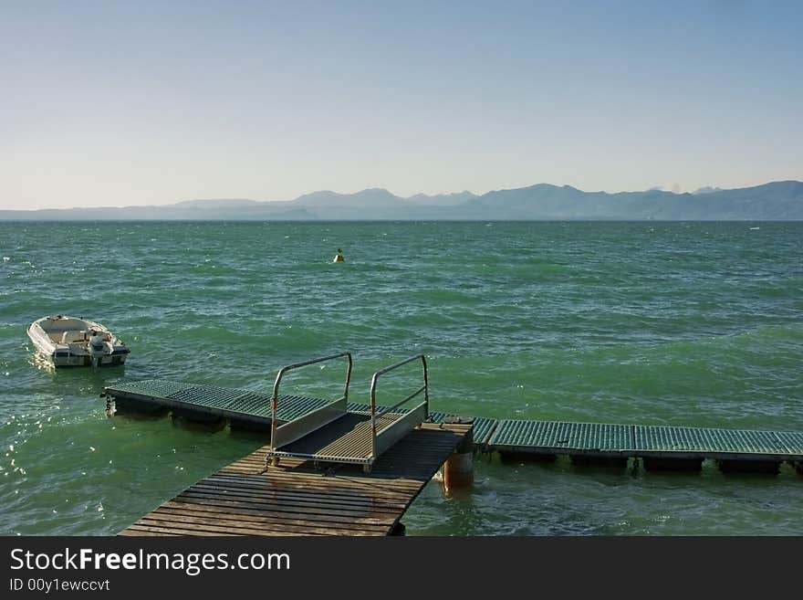 Beautiful view on Garda lake with mountains on horizon. Beautiful view on Garda lake with mountains on horizon