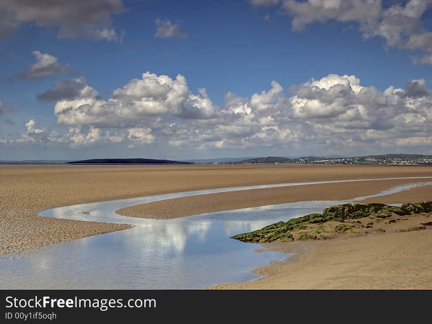 Sand at low tide in the Morcambe Bay estuary at low tide. Sand at low tide in the Morcambe Bay estuary at low tide