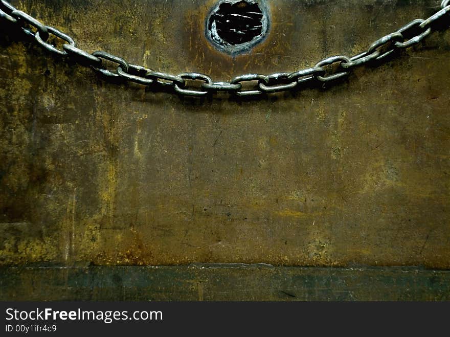 Chain hanging on a box with chains inside. Chain hanging on a box with chains inside.